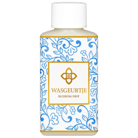 Wasgeurtje Blossom Drip wasparfum met blauwe bloemendesign en gouden logo.